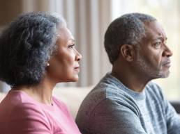 When Intimacy Fades Quietly: The Emotional Loneliness Many Long-Term Couples Carry 7 Long-term couple sitting side by side in silence, illustrating emotional loneliness in marriage